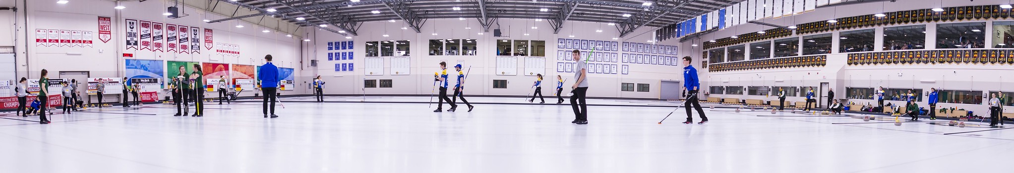 individuals practicing curling